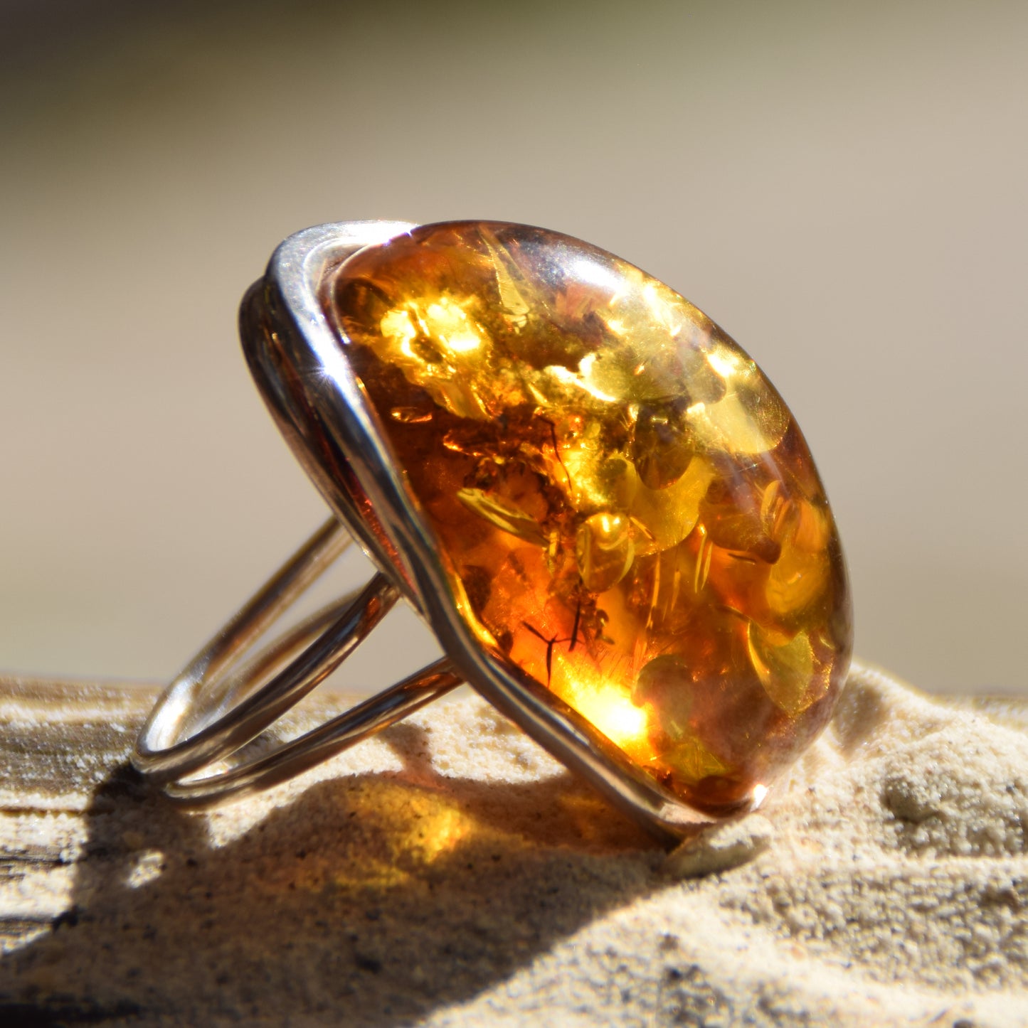 Large adjustable ring with cognac-colored oval natural amber gemstone and 925 Sterling Silver, MJ Baltica, BP108