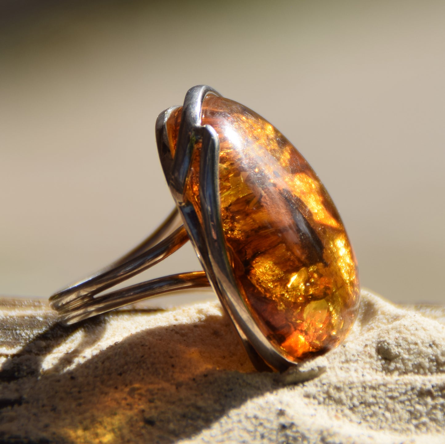 Large ring crafted with Cognac-colored Natural Amber with various inclusions and 925 Silver, MJ Baltica, BP115