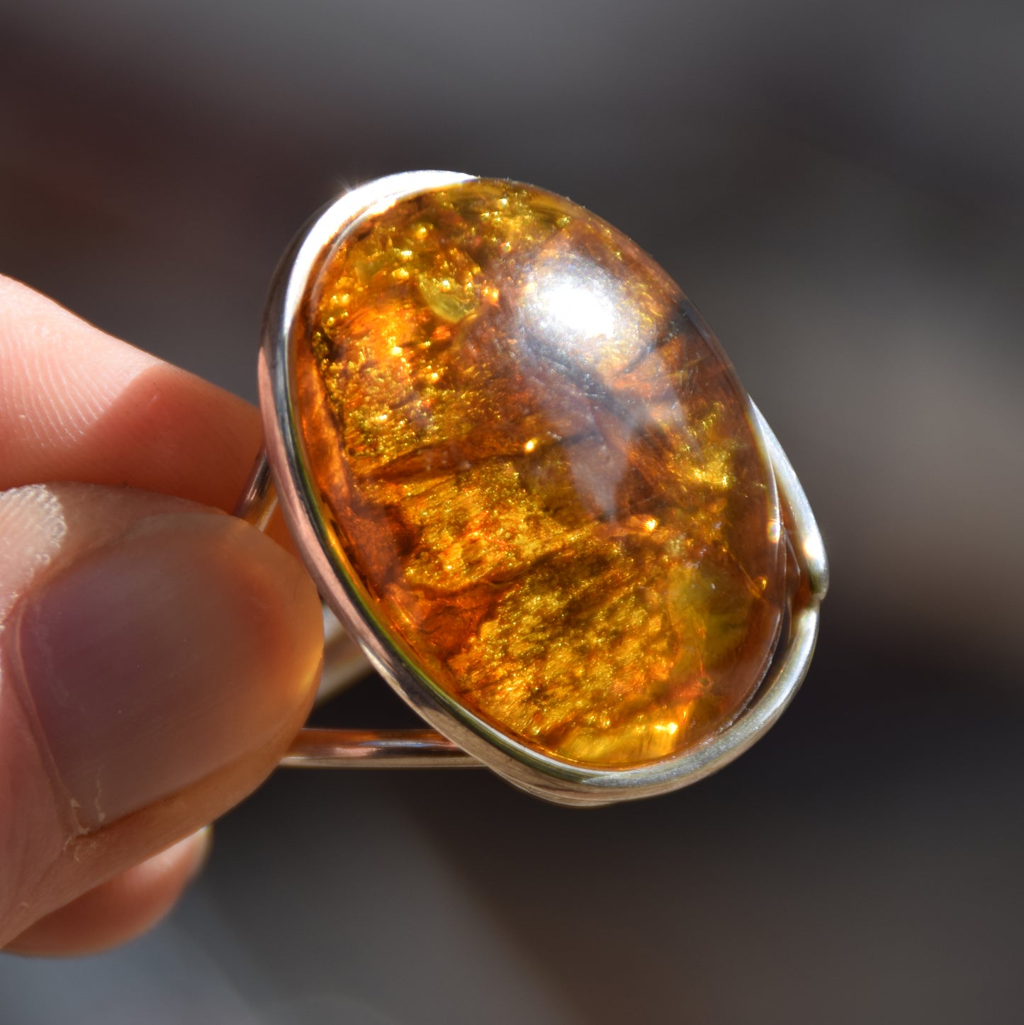 Large ring crafted with Cognac-colored Natural Amber with various inclusions and 925 Silver, MJ Baltica, BP115
