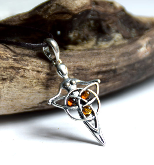 Celtic fairy pendant holding a triskele adorned with natural cognac amber, MJ Baltica, BW050