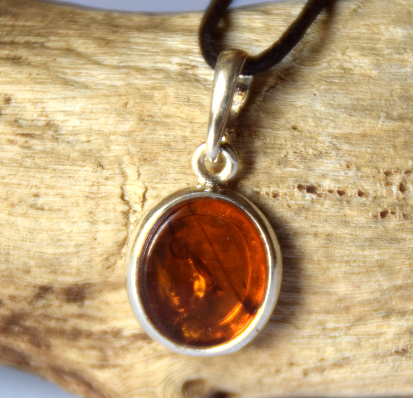 Delicate pendant created with natural cognac-colored Amber and 925 Silver, MJ Baltica, BW141