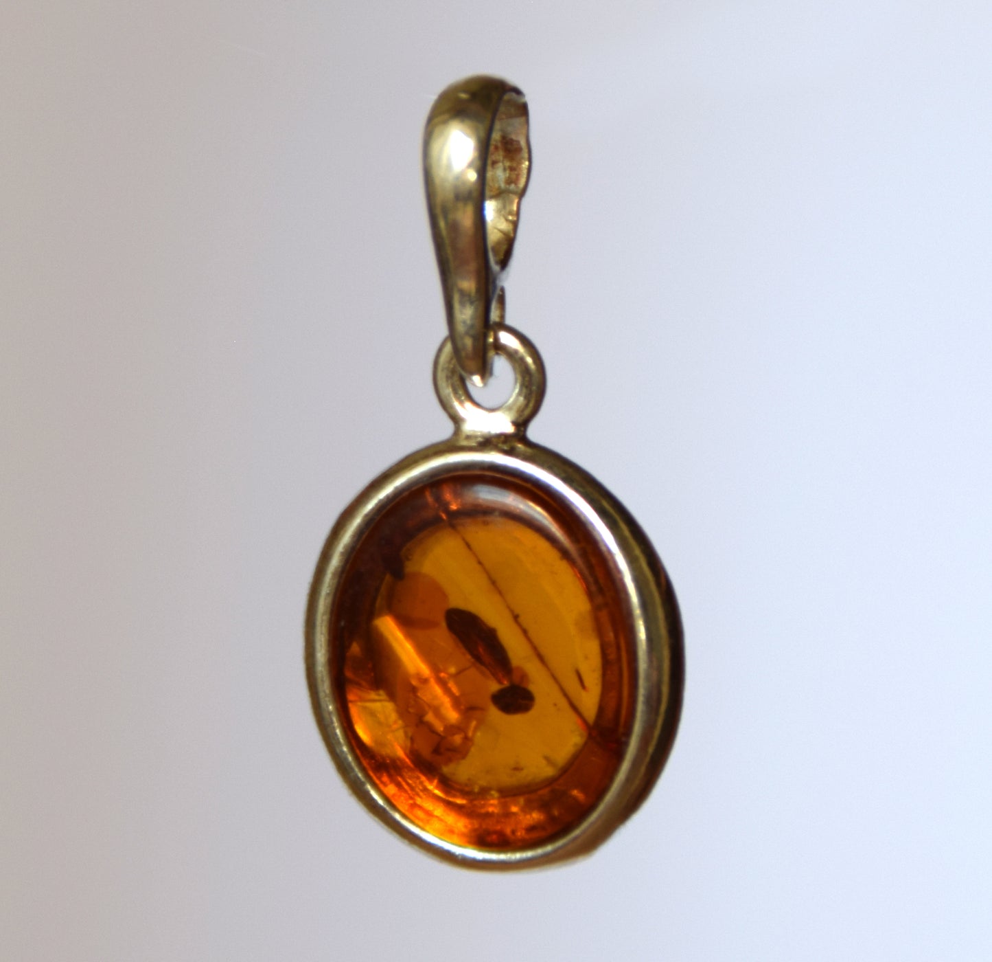 Delicate pendant created with natural cognac-colored Amber and 925 Silver, MJ Baltica, BW141