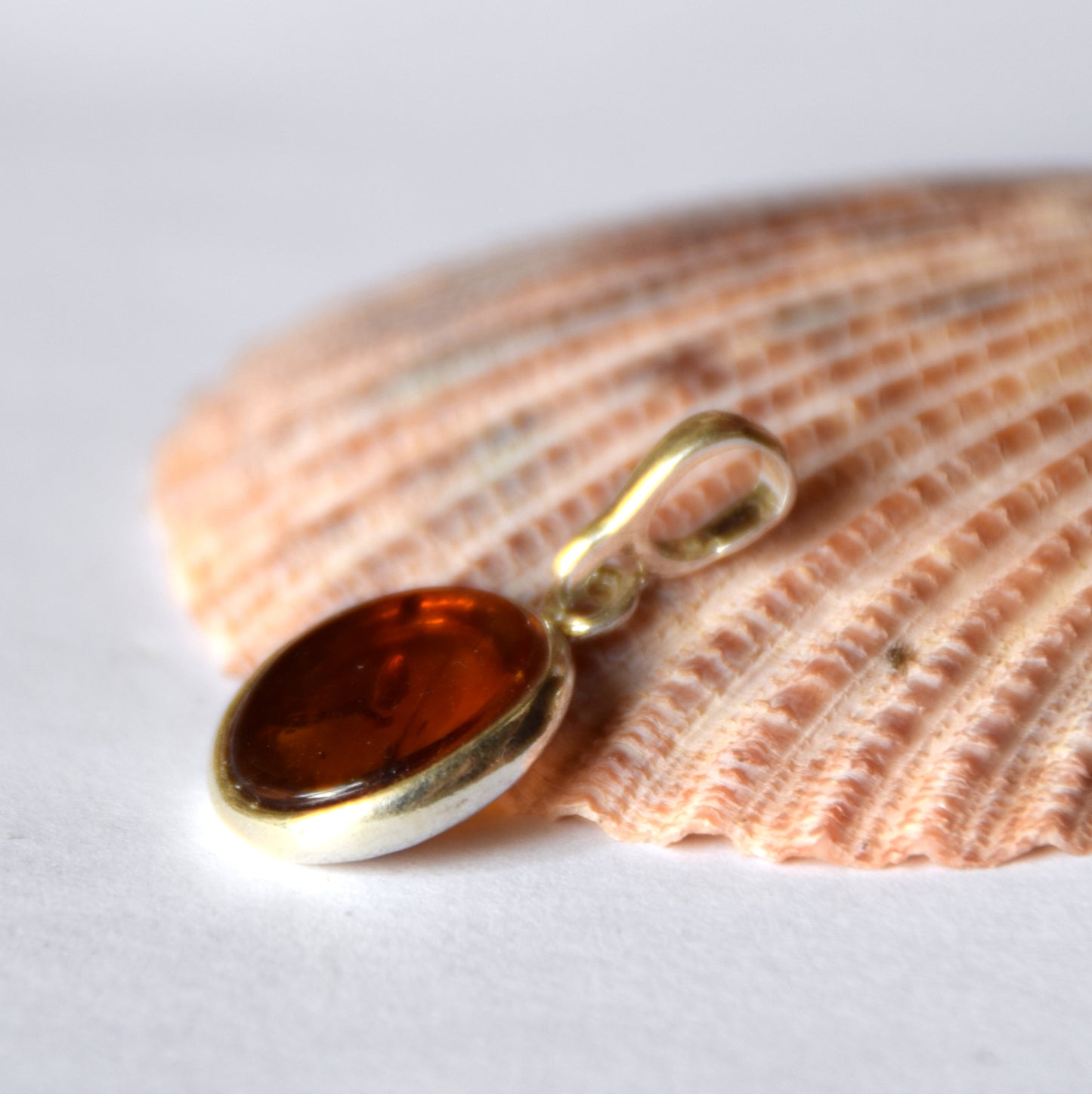 Delicate pendant created with natural cognac-colored Amber and 925 Silver, MJ Baltica, BW141