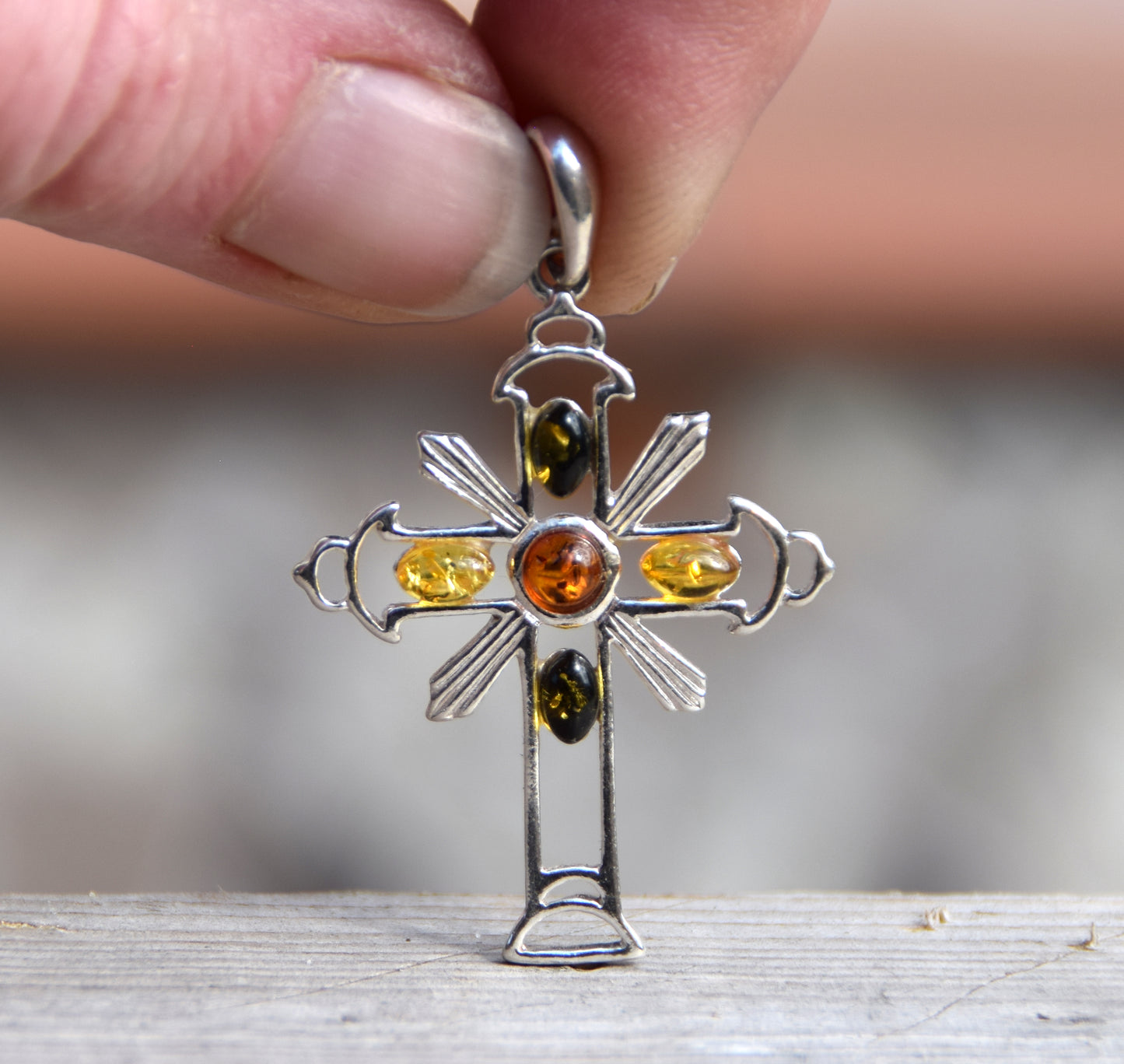 Bright cross-shaped pendant in natural Amber of various shades and 925 Sterling Silver, MJ Baltica, BW181