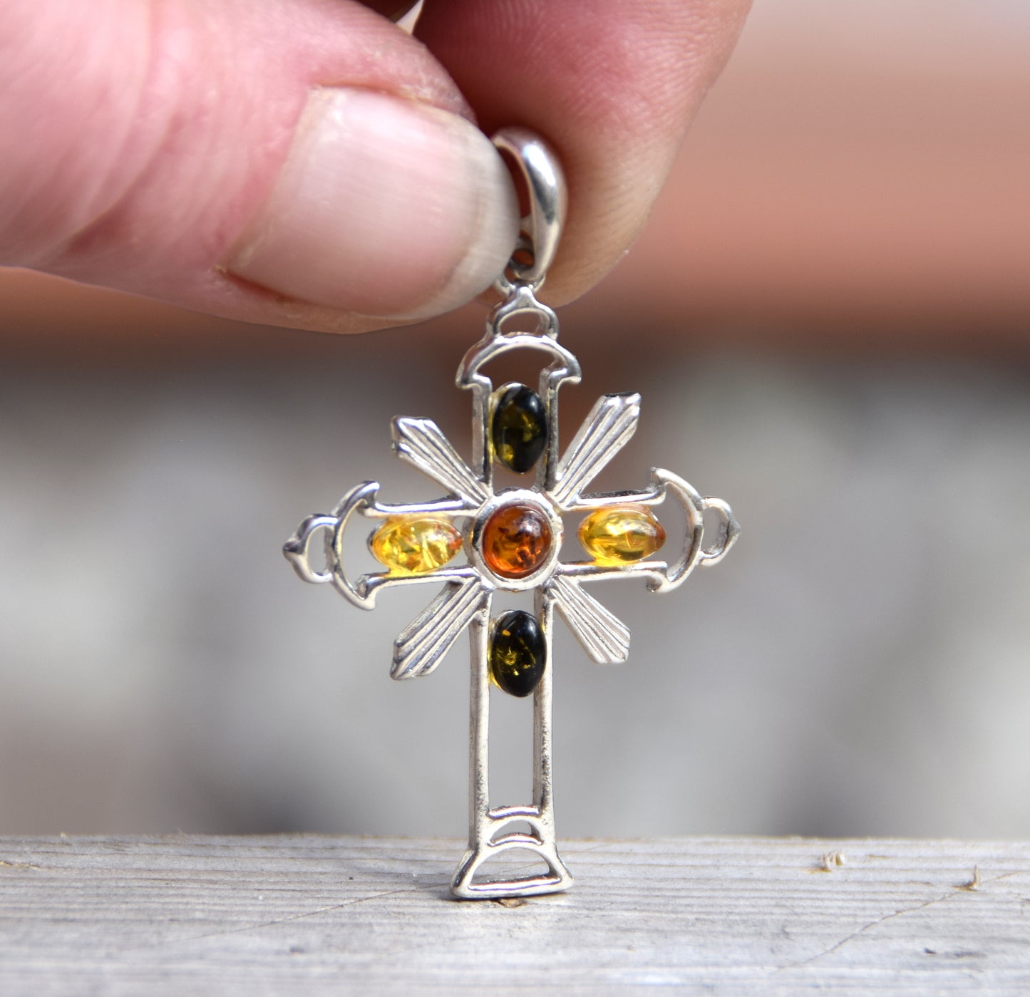 Bright cross-shaped pendant in natural Amber of various shades and 925 Sterling Silver, MJ Baltica, BW181
