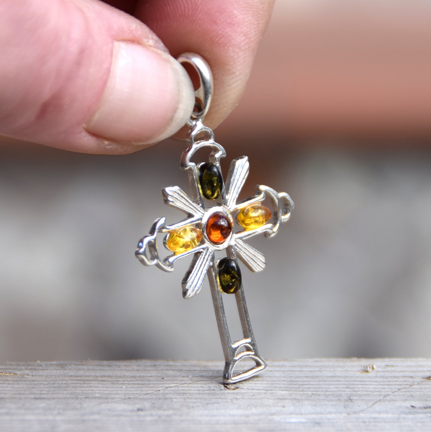 Bright cross-shaped pendant in natural Amber of various shades and 925 Sterling Silver, MJ Baltica, BW181