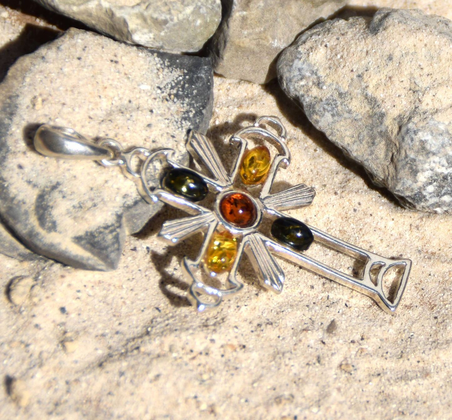 Bright cross-shaped pendant in natural Amber of various shades and 925 Sterling Silver, MJ Baltica, BW181