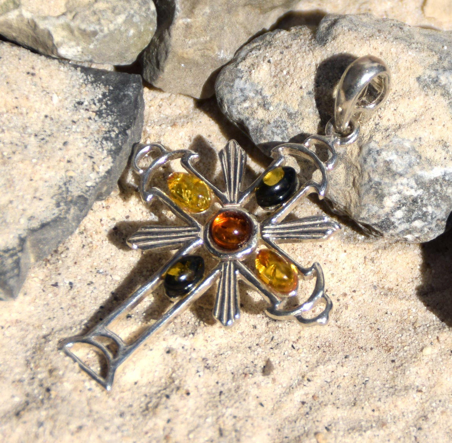 Bright cross-shaped pendant in natural Amber of various shades and 925 Sterling Silver, MJ Baltica, BW181