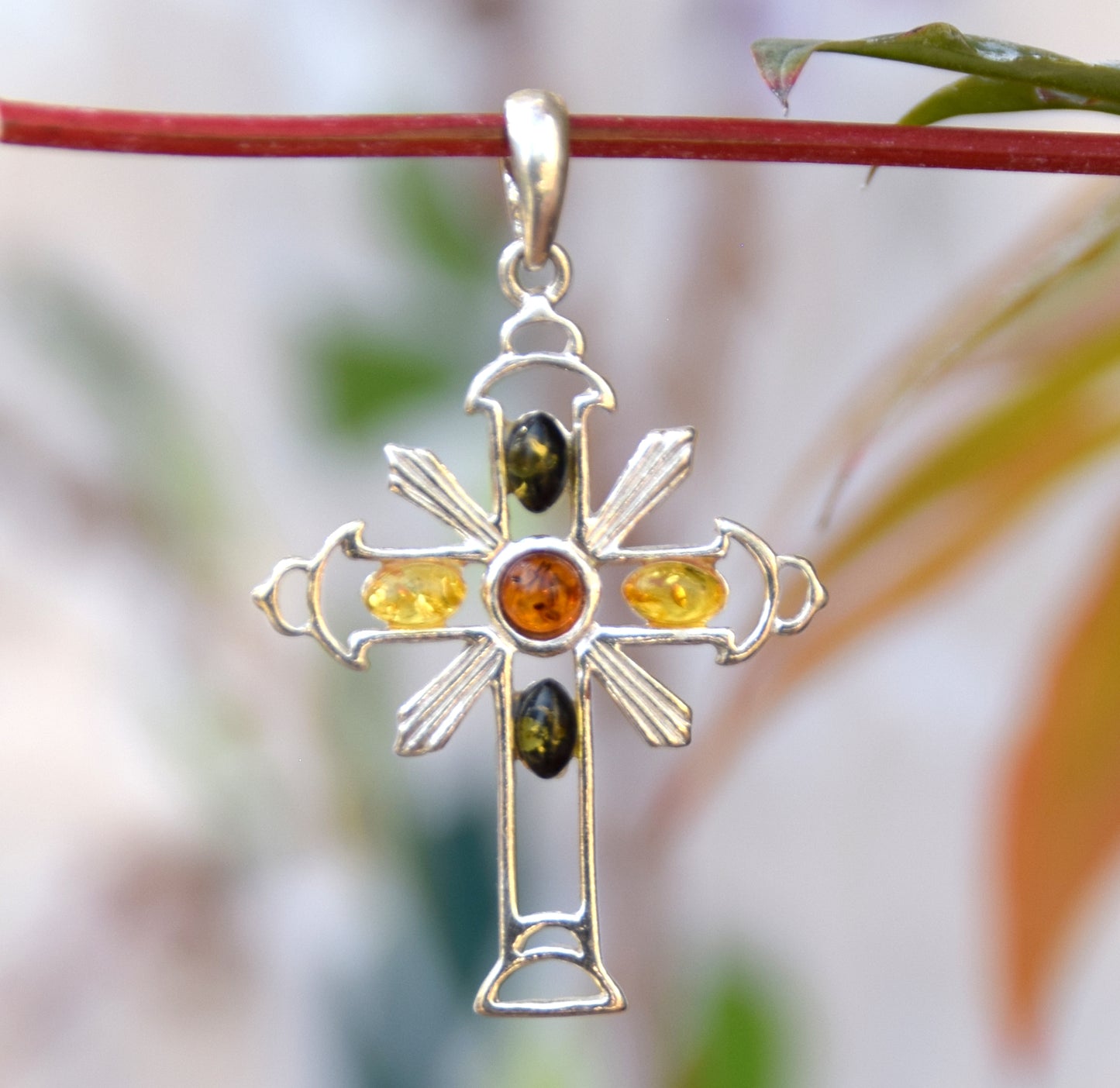 Bright cross-shaped pendant in natural Amber of various shades and 925 Sterling Silver, MJ Baltica, BW181