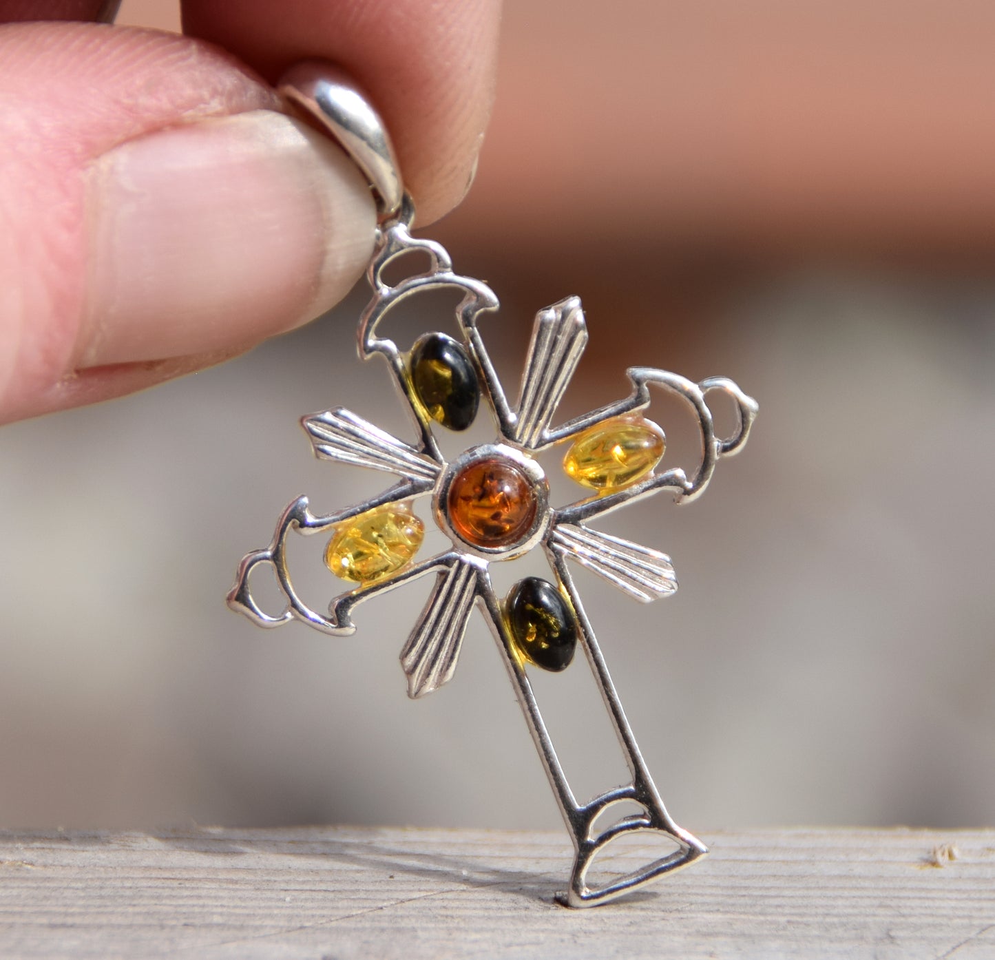 Bright cross-shaped pendant in natural Amber of various shades and 925 Sterling Silver, MJ Baltica, BW181