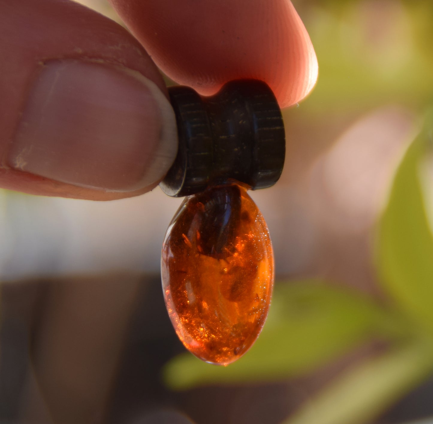 Lightweight oval pendant in natural cognac-colored Amber and mahogany wood, MJ Baltica, BW210