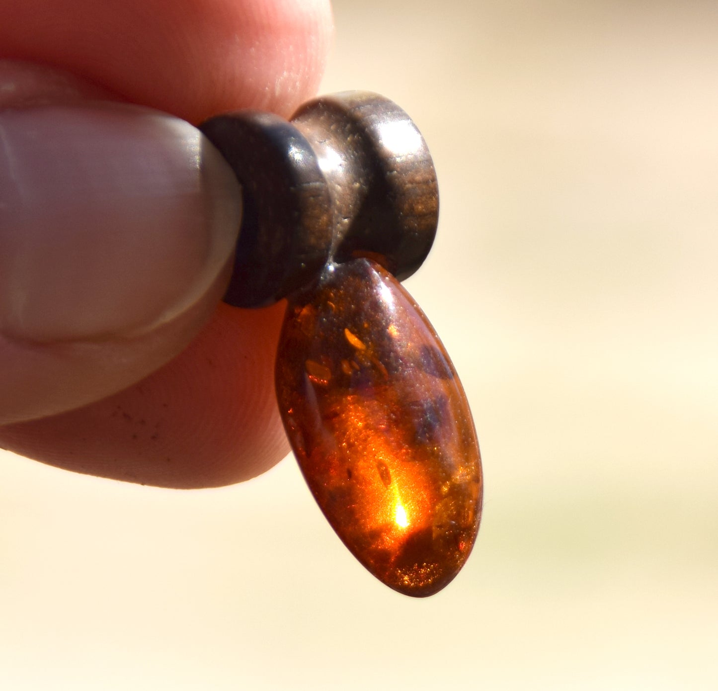 Lightweight oval pendant in natural cognac-colored Amber and mahogany wood, MJ Baltica, BW210