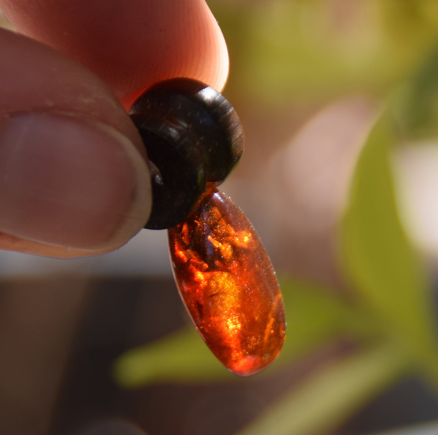 Lightweight oval pendant in natural cognac-colored Amber and mahogany wood, MJ Baltica, BW210