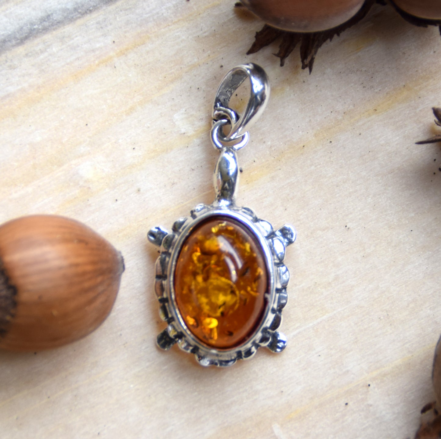 Bright pendant with a turtle in natural cognac brown Amber and 925 Silver, MJ Baltica, BW238