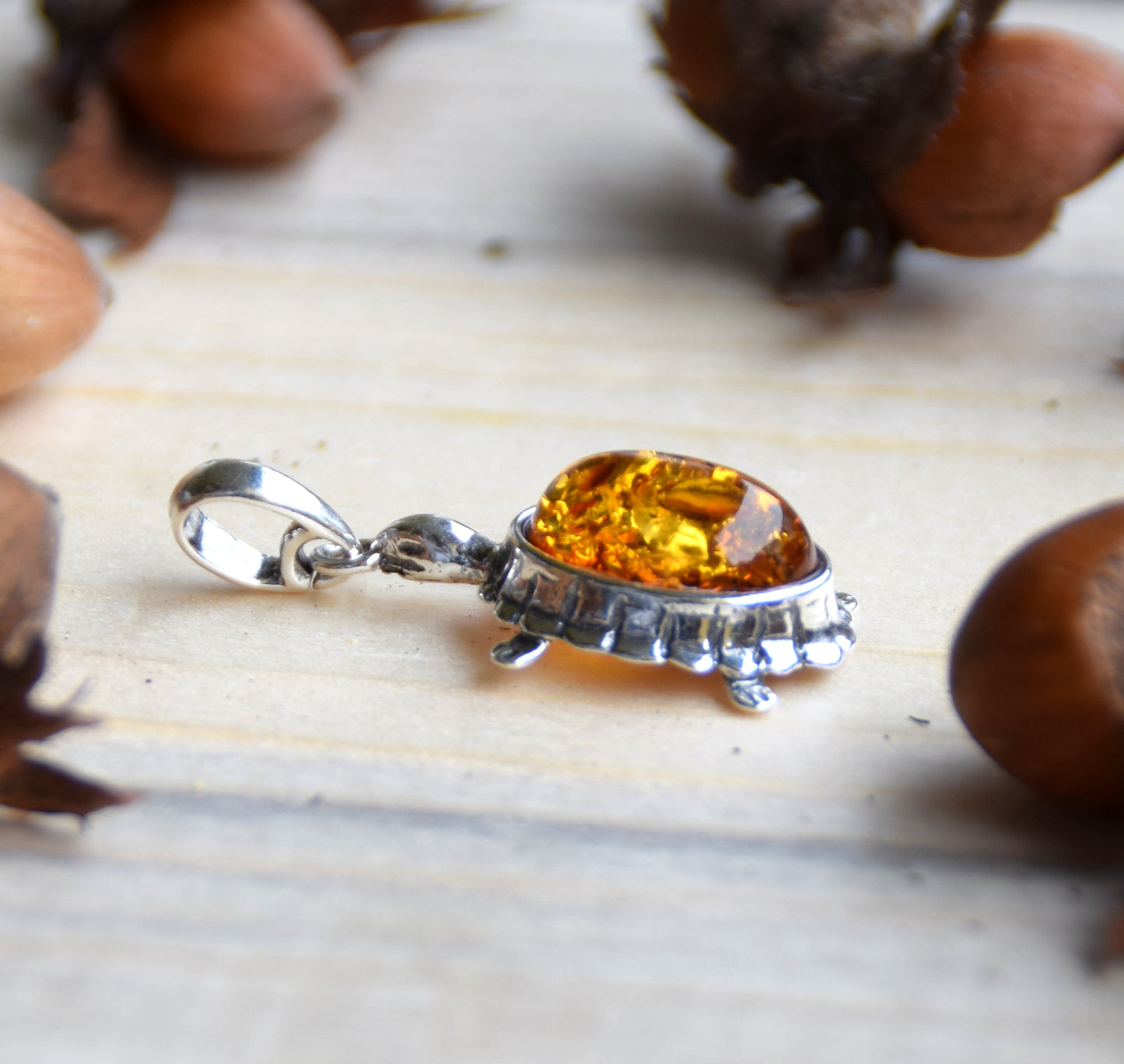 Bright pendant with a turtle in natural cognac brown Amber and 925 Silver, MJ Baltica, BW238