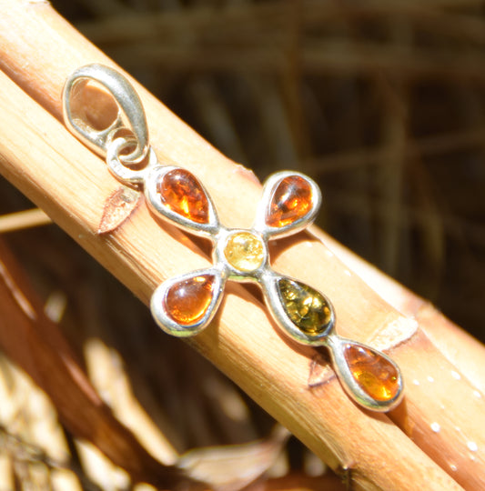 Delicate cross-shaped pendant made of natural amber in various shades and 925 sterling silver, MJ Baltica, BW257