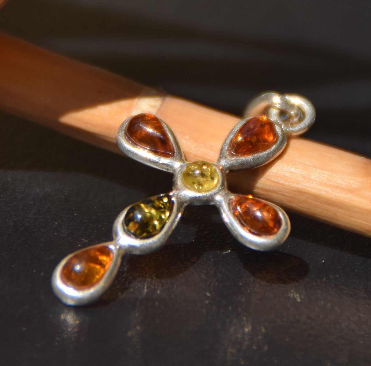 Delicate cross-shaped pendant made of natural amber in various shades and 925 sterling silver, MJ Baltica, BW257
