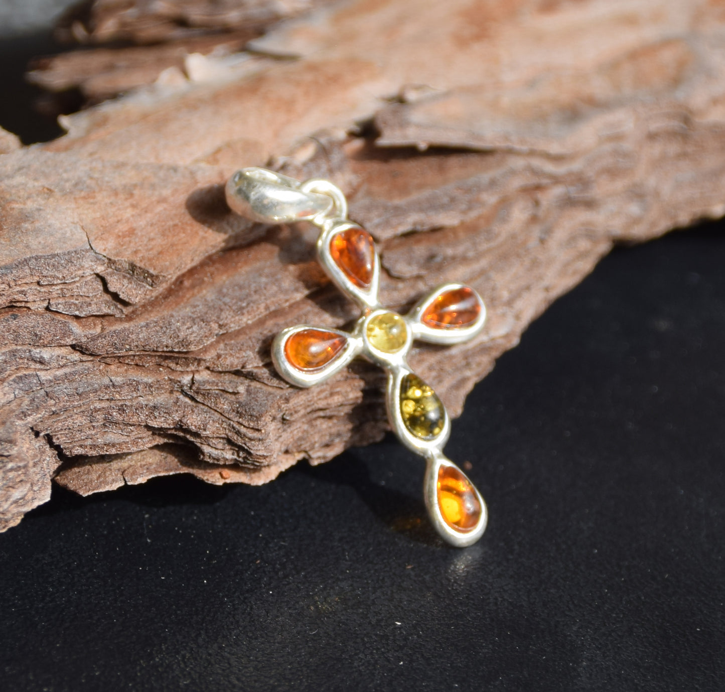 Delicate cross-shaped pendant made of natural amber in various shades and 925 sterling silver, MJ Baltica, BW257