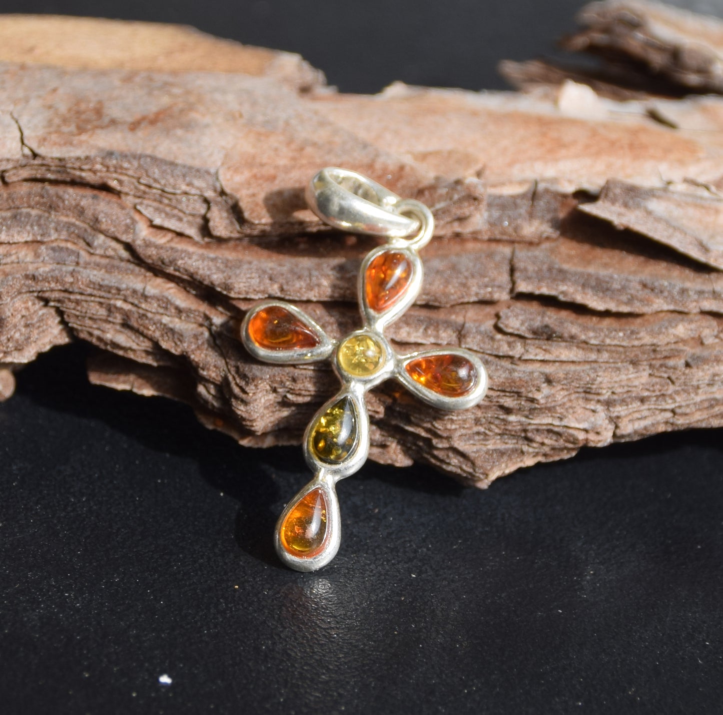 Delicate cross-shaped pendant made of natural amber in various shades and 925 sterling silver, MJ Baltica, BW257