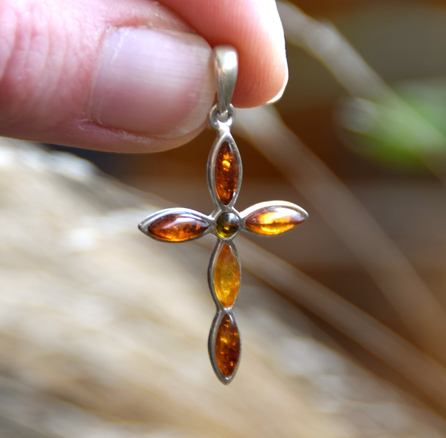 Delicate cross-shaped pendant in natural Amber of various shades and 925 Silver, MJ Baltica, BW259