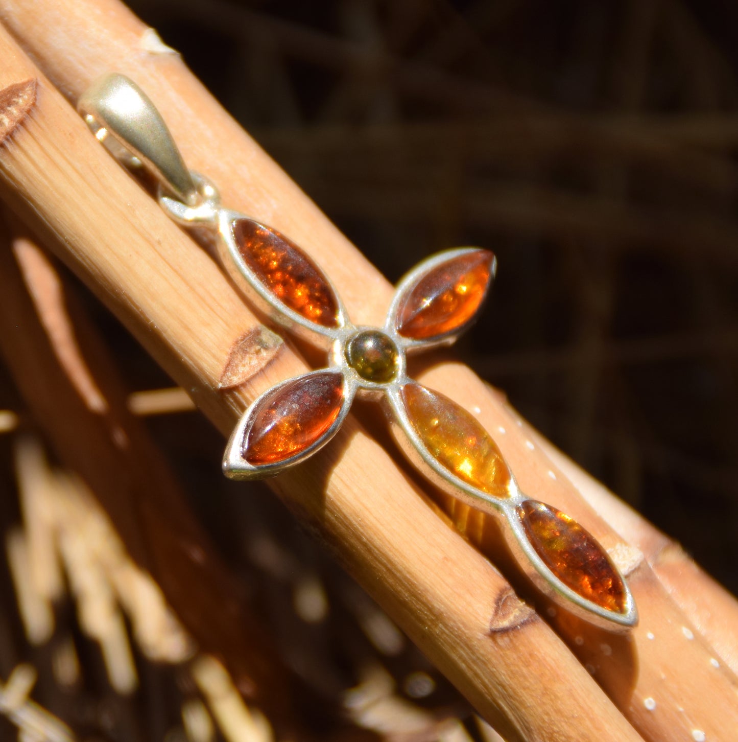 Delicate cross-shaped pendant in natural Amber of various shades and 925 Silver, MJ Baltica, BW259