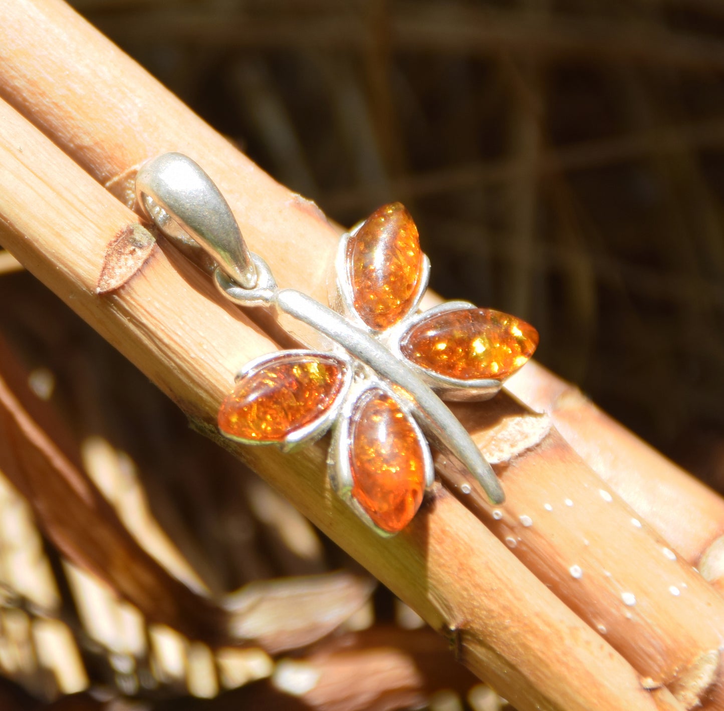 Lightweight pendant with a butterfly in natural cognac-colored Amber and 925 Silver, MJ Baltica, BW260