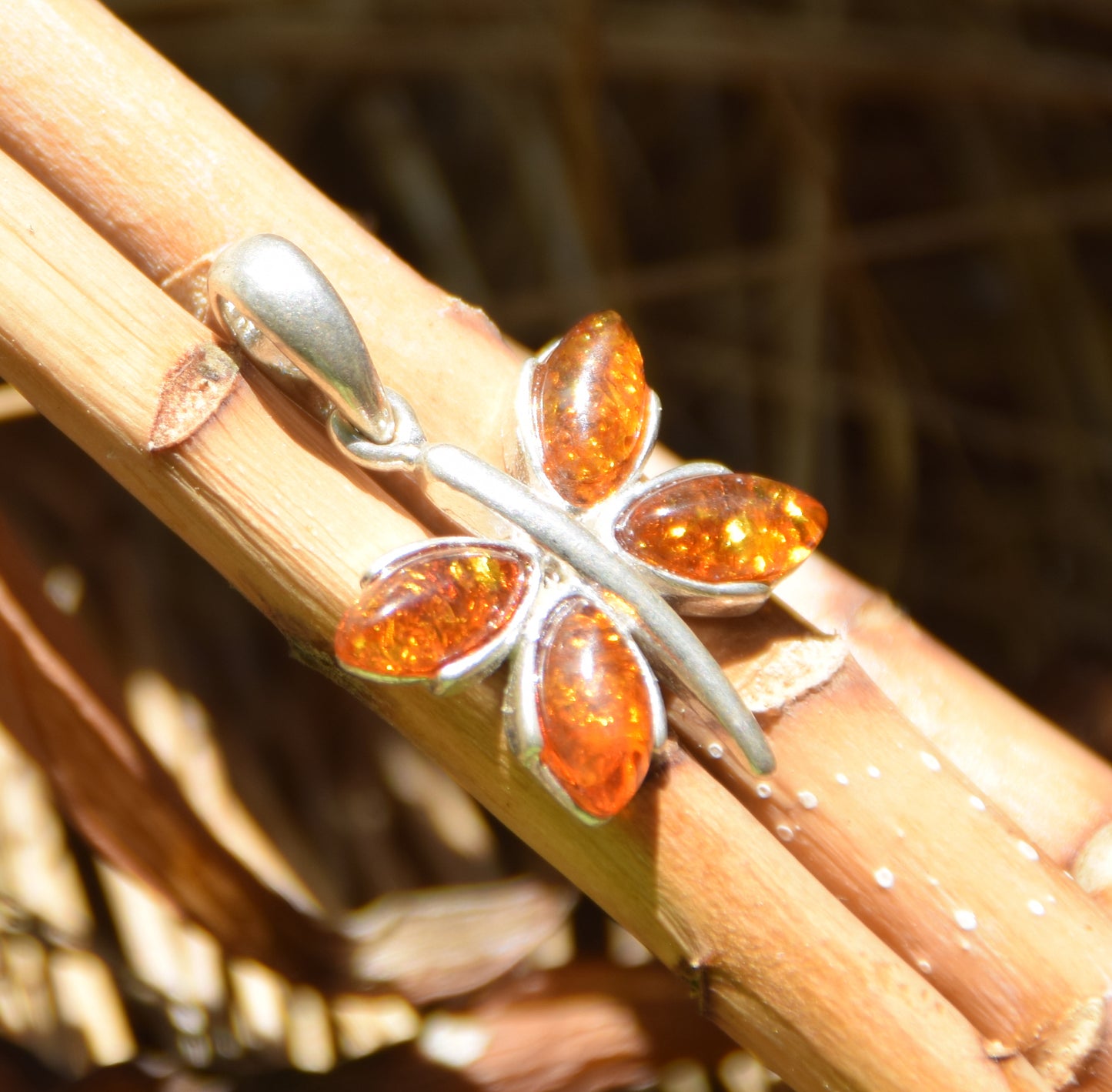 Lightweight pendant with a butterfly in natural cognac-colored Amber and 925 Silver, MJ Baltica, BW260