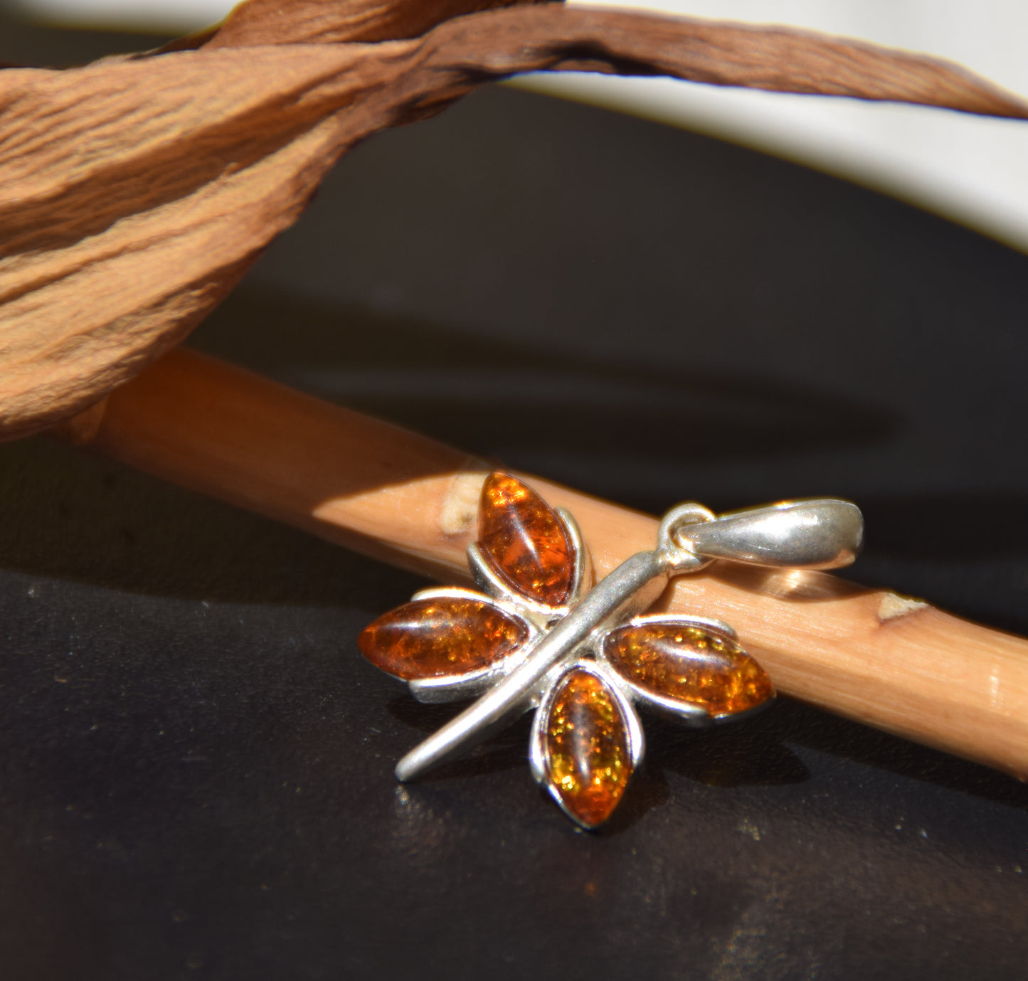 Lightweight pendant with a butterfly in natural cognac-colored Amber and 925 Silver, MJ Baltica, BW260