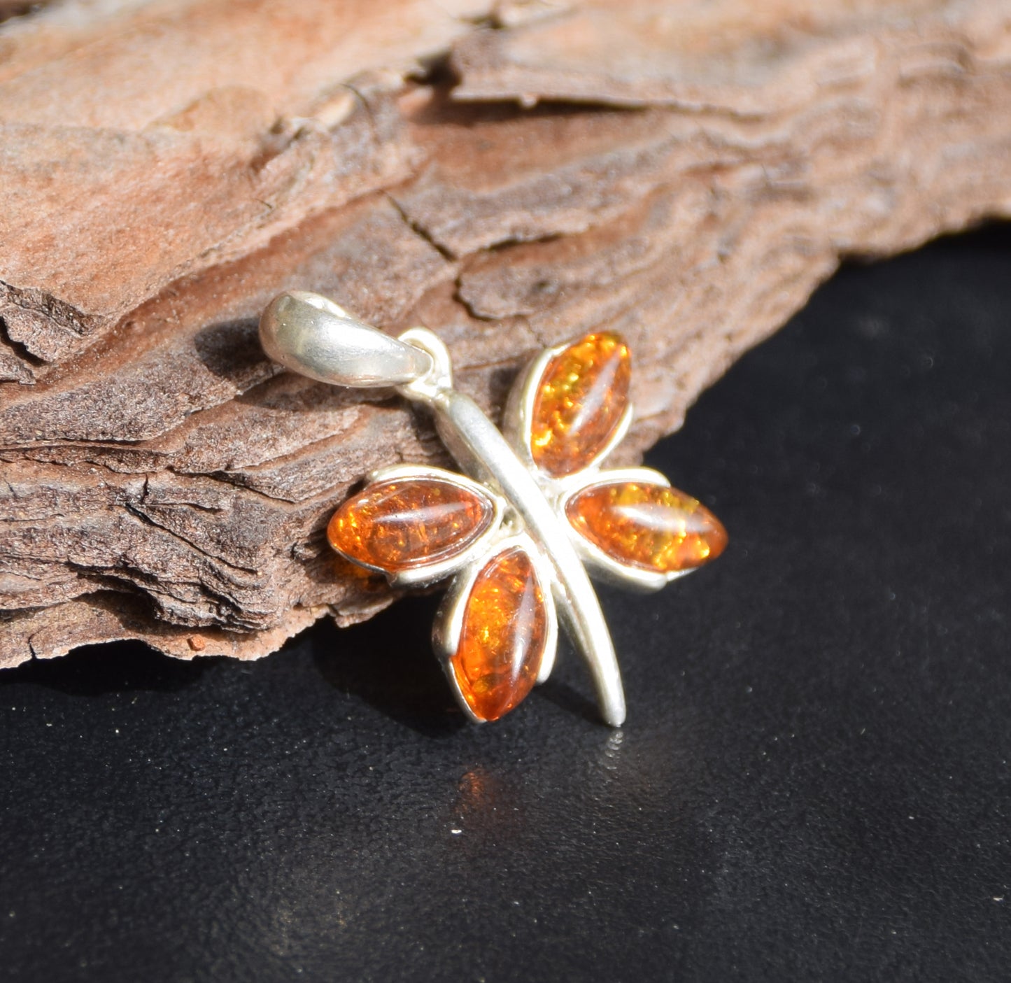 Lightweight pendant with a butterfly in natural cognac-colored Amber and 925 Silver, MJ Baltica, BW260