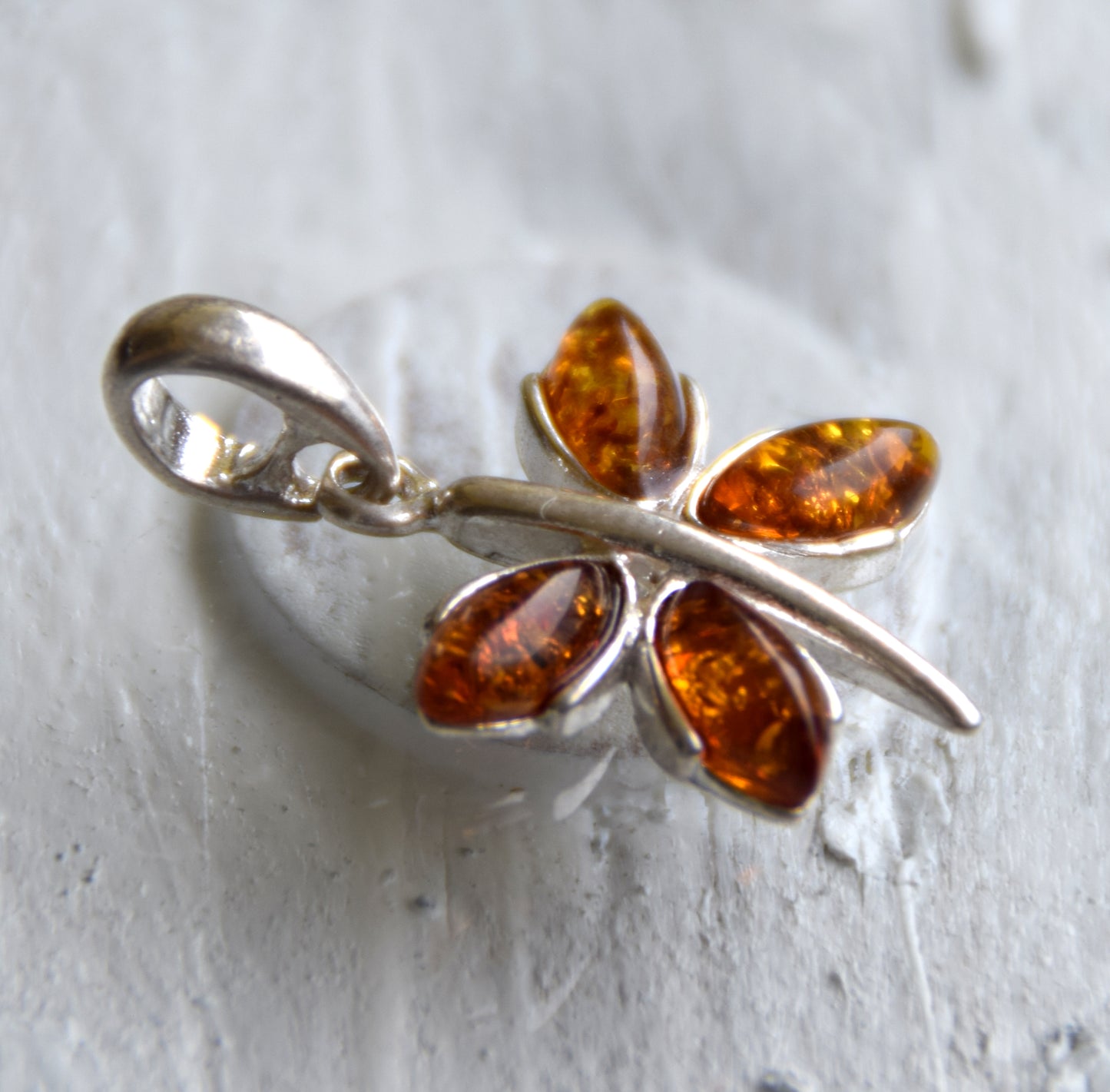 Lightweight pendant with a butterfly in natural cognac-colored Amber and 925 Silver, MJ Baltica, BW260