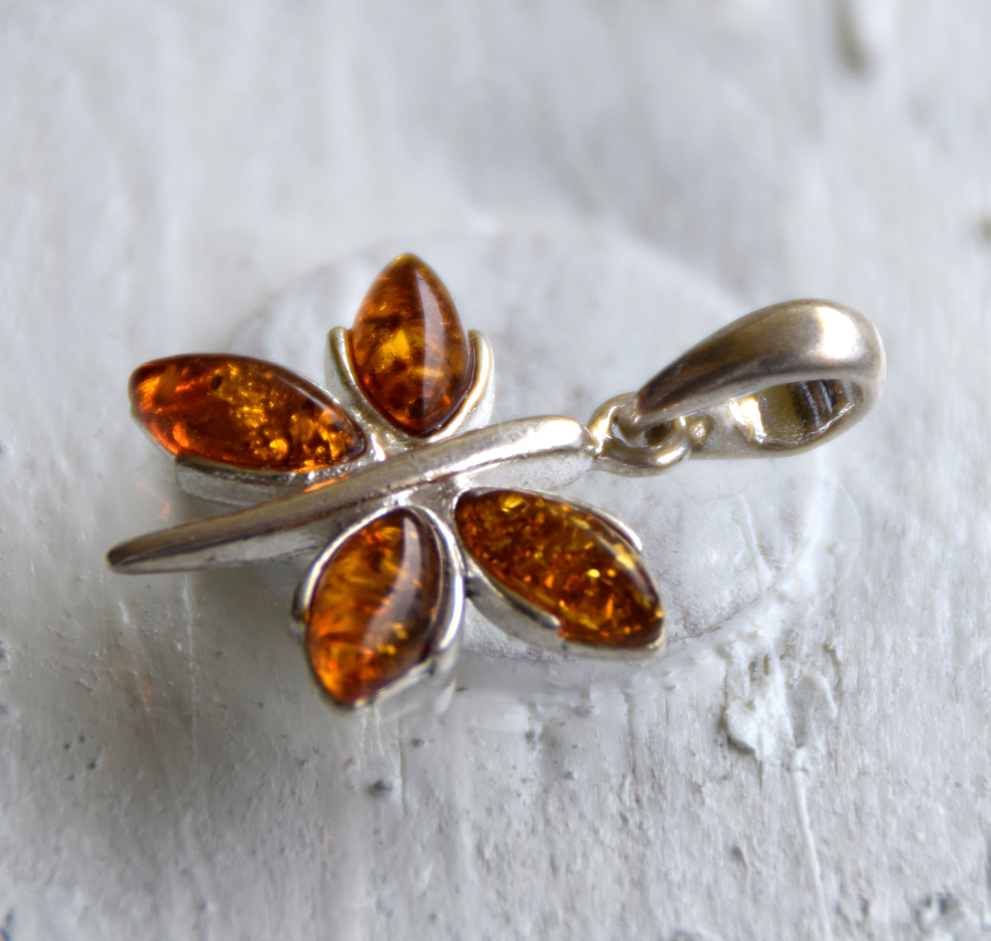 Lightweight pendant with a butterfly in natural cognac-colored Amber and 925 Silver, MJ Baltica, BW260