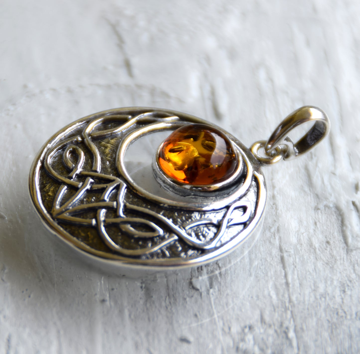 Intense Celtic-style pendant with triskelion in natural cognac Amber and Sterling Silver, MJ Baltica, BW275