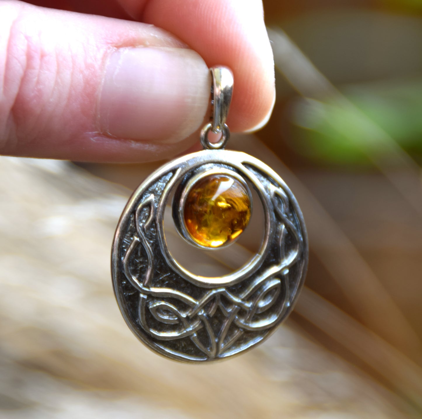 Intense Celtic-style pendant with triskelion in natural cognac Amber and Sterling Silver, MJ Baltica, BW275