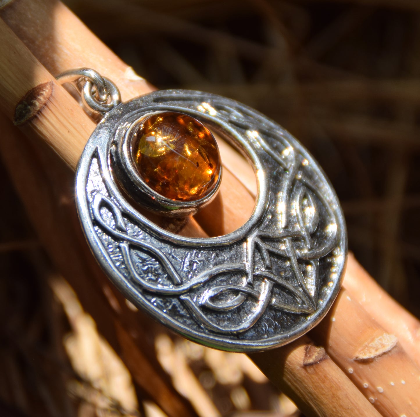 Intense Celtic-style pendant with triskelion in natural cognac Amber and Sterling Silver, MJ Baltica, BW275