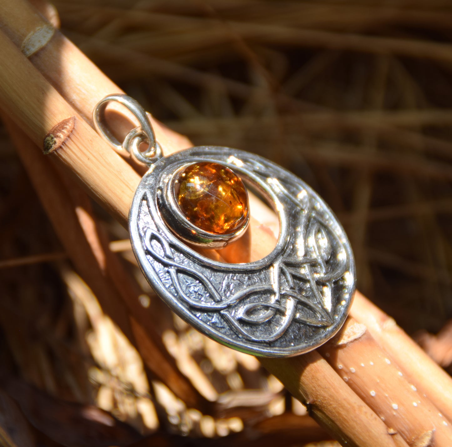 Intense Celtic-style pendant with triskelion in natural cognac Amber and Sterling Silver, MJ Baltica, BW275