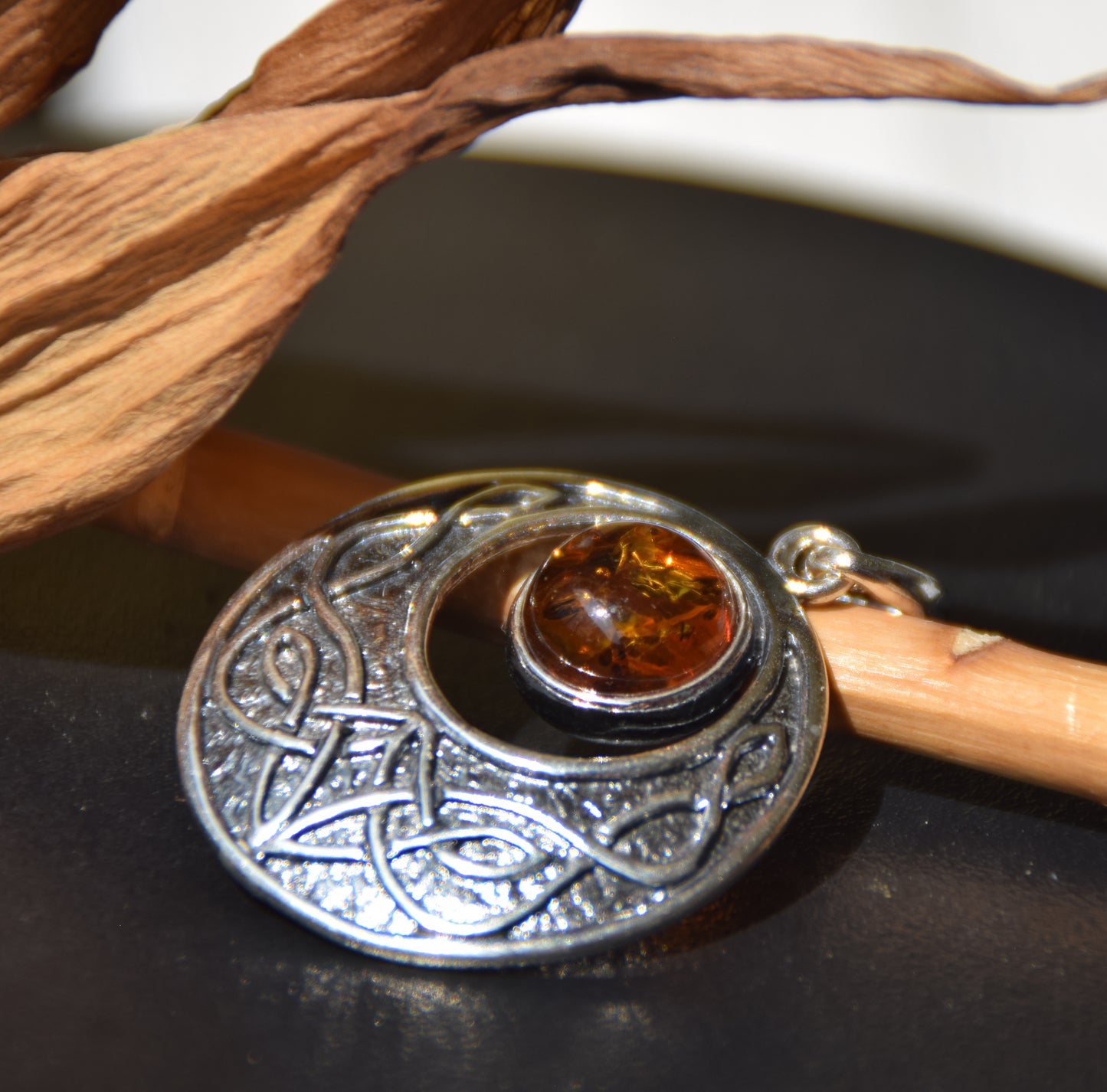 Intense Celtic-style pendant with triskelion in natural cognac Amber and Sterling Silver, MJ Baltica, BW275
