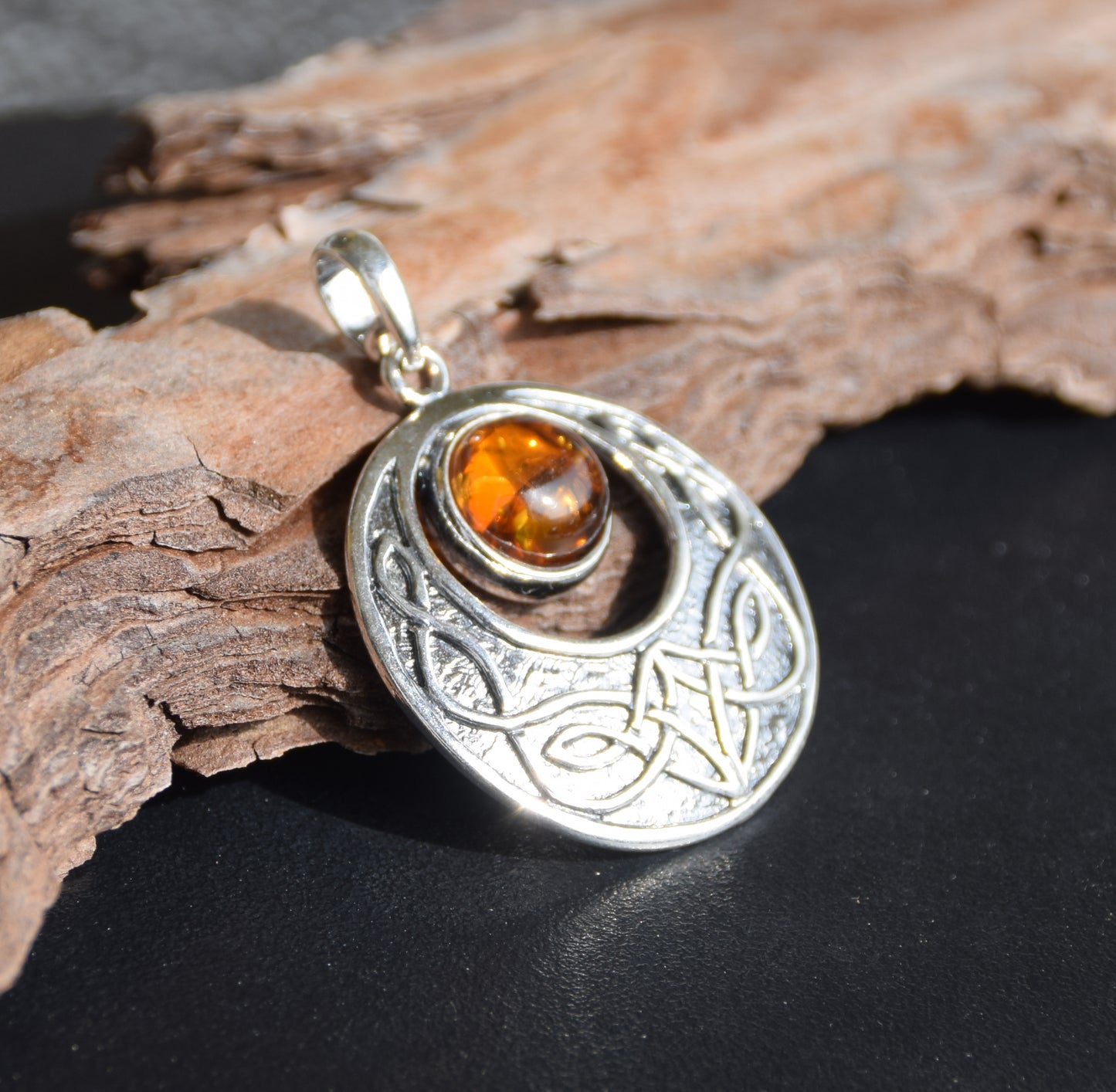 Intense Celtic-style pendant with triskelion in natural cognac Amber and Sterling Silver, MJ Baltica, BW275