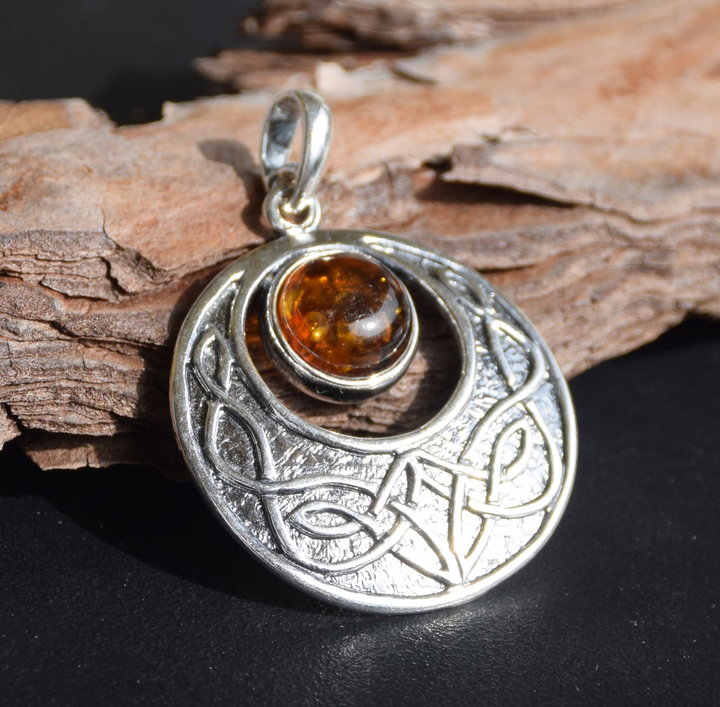 Intense Celtic-style pendant with triskelion in natural cognac Amber and Sterling Silver, MJ Baltica, BW275