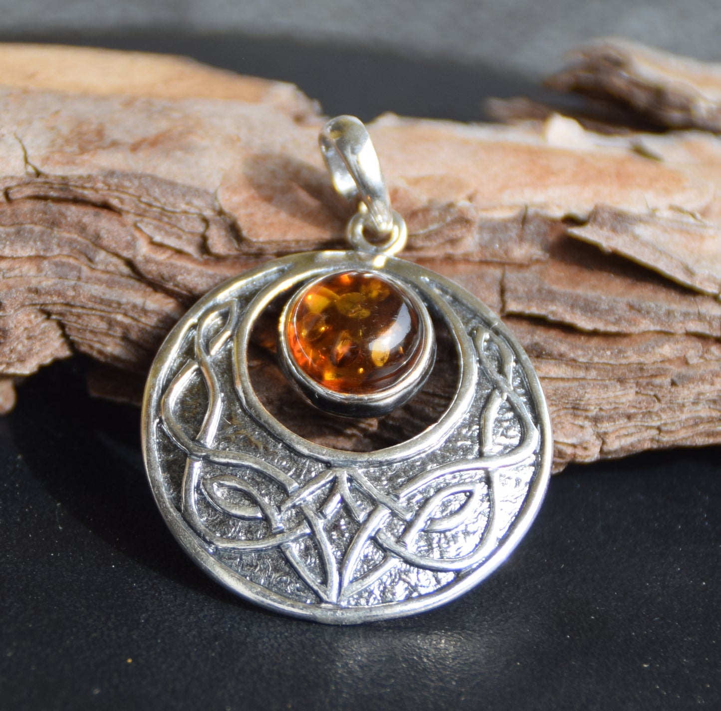 Intense Celtic-style pendant with triskelion in natural cognac Amber and Sterling Silver, MJ Baltica, BW275
