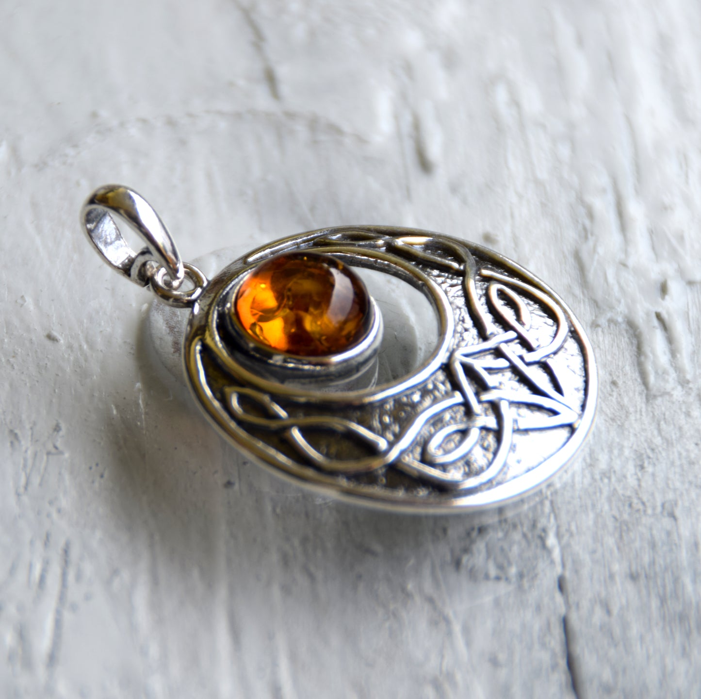 Intense Celtic-style pendant with triskelion in natural cognac Amber and Sterling Silver, MJ Baltica, BW275
