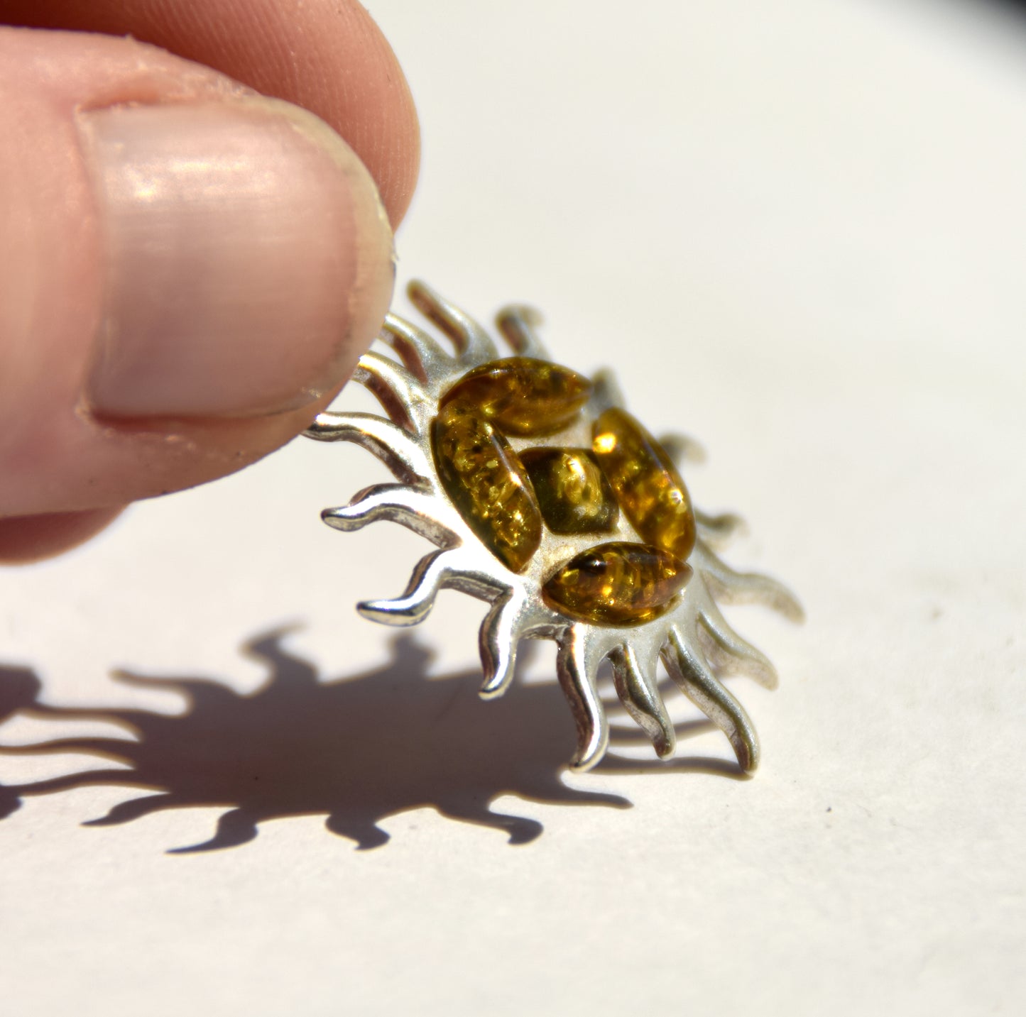 Refined sun-shaped pendant with natural green amber, 925 Silver, MJ Baltica, BW291
