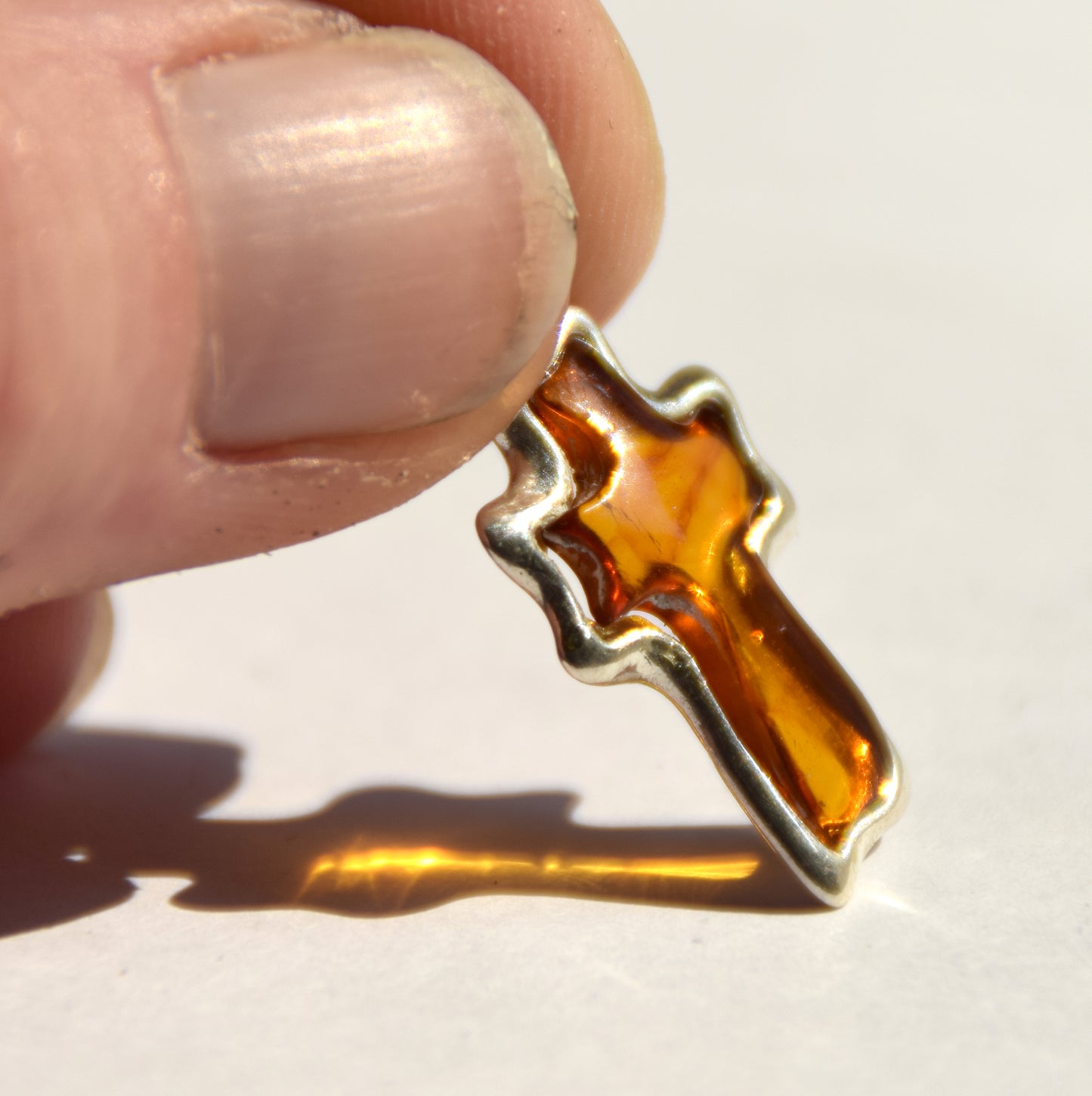 Cognac-colored natural Amber and 925 Sterling Silver carved cross pendant, MJ Baltica, BW298