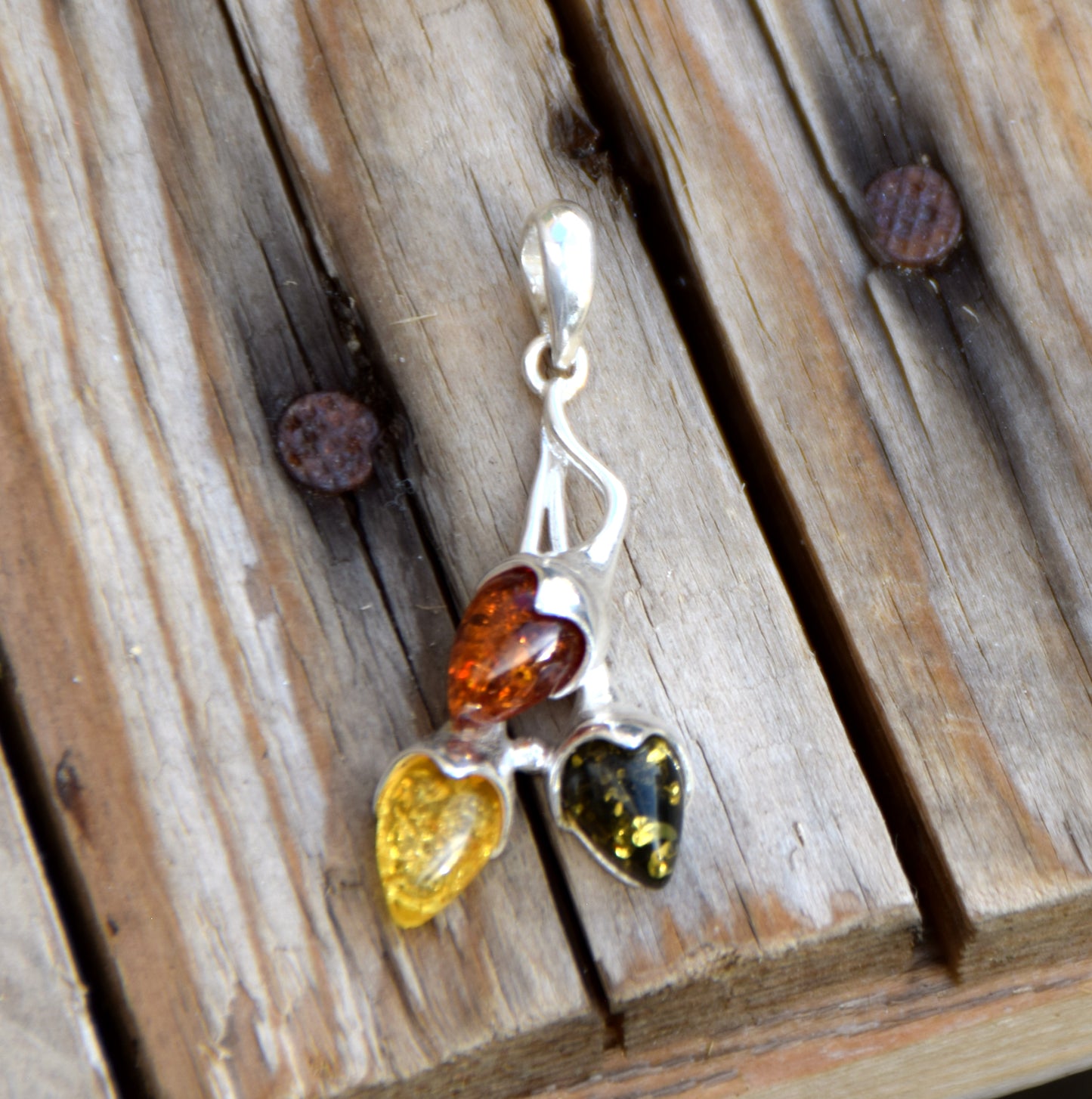 Luminous pendant with branch and natural Amber leaves in various shades, set in 925 Sterling Silver, MJ Baltica, BW309