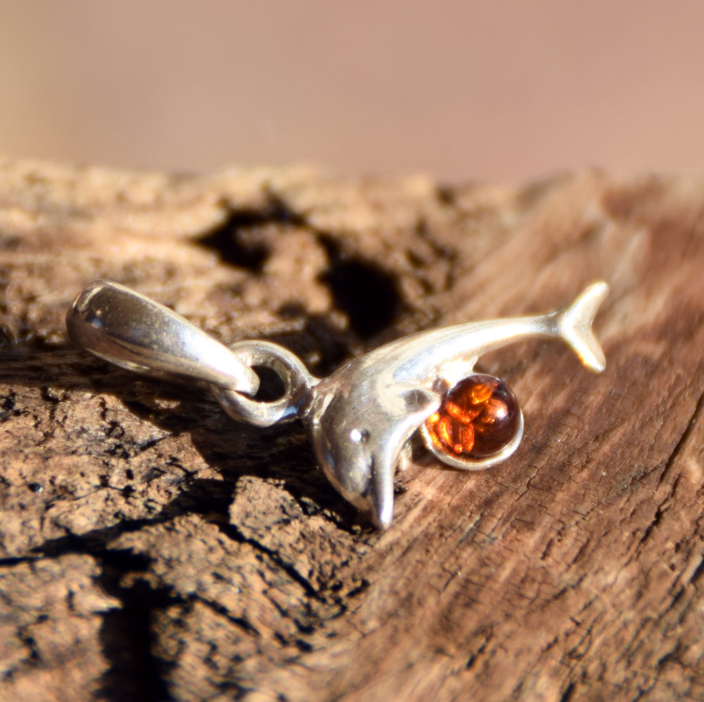Delicate pendant with a joyful dolphin in cognac-colored natural Amber and 925 Silver, MJ Baltica, BW315