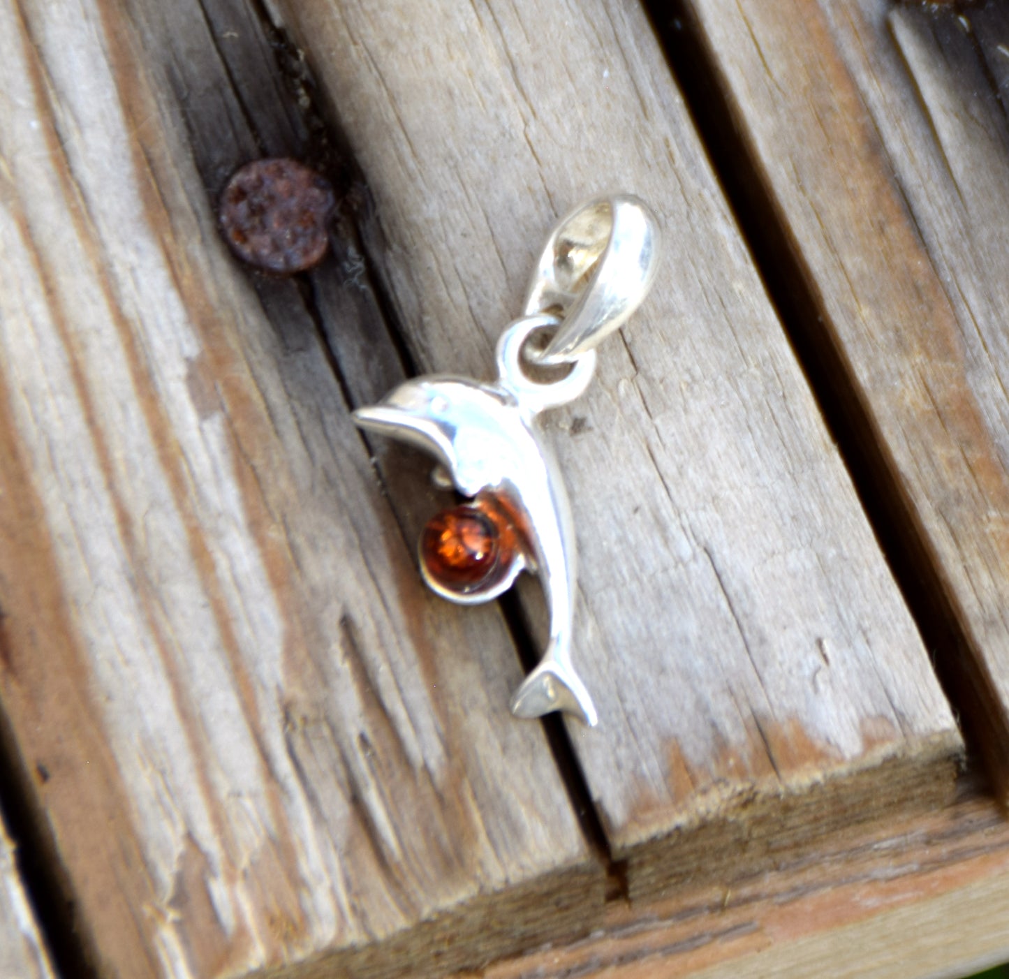Delicate pendant with a joyful dolphin in cognac-colored natural Amber and 925 Silver, MJ Baltica, BW315
