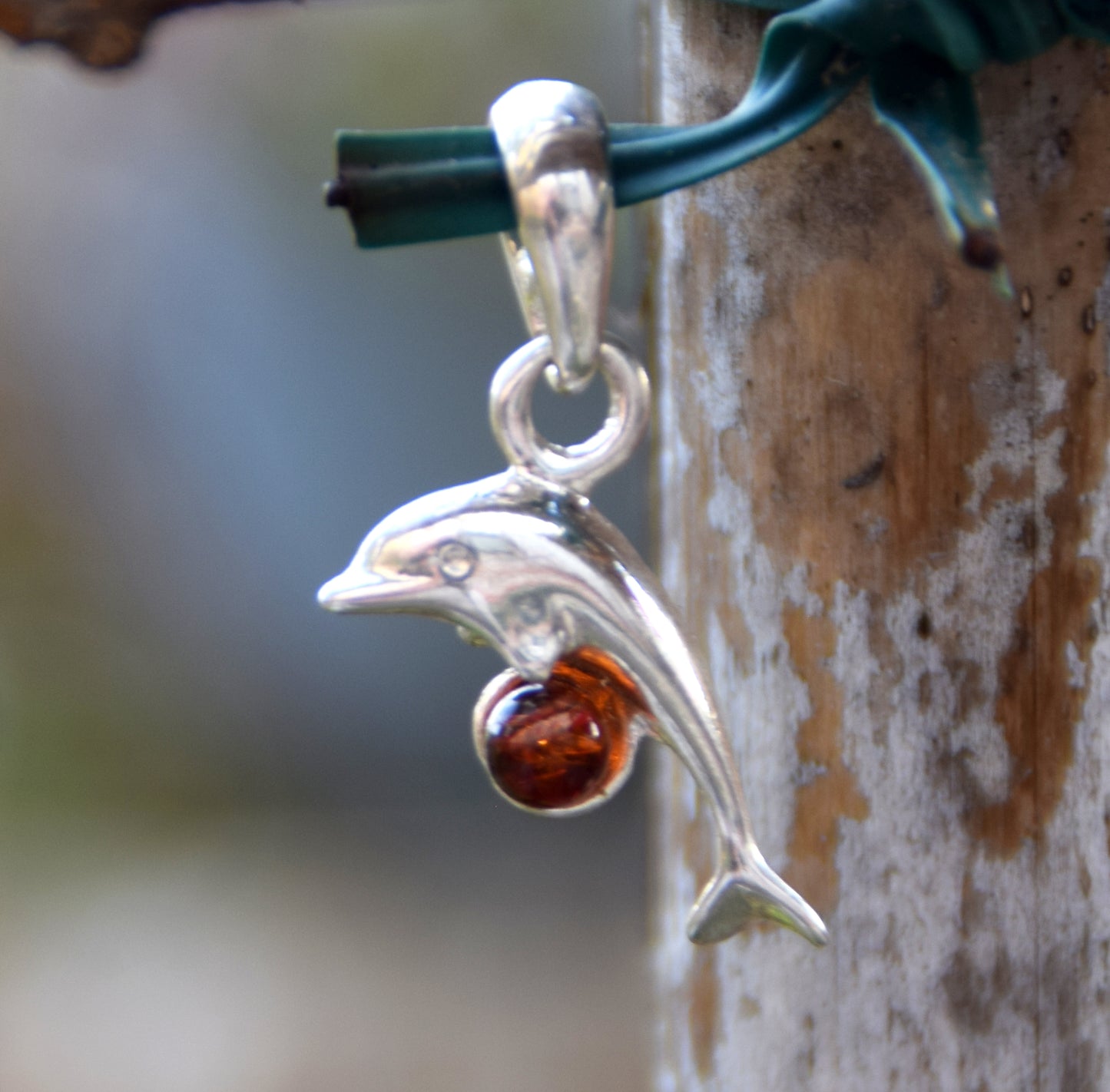 Delicate pendant with a joyful dolphin in cognac-colored natural Amber and 925 Silver, MJ Baltica, BW315