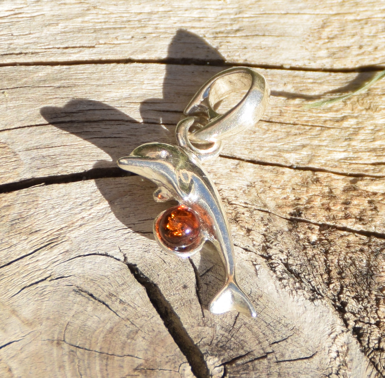 Delicate pendant with a joyful dolphin in cognac-colored natural Amber and 925 Silver, MJ Baltica, BW315