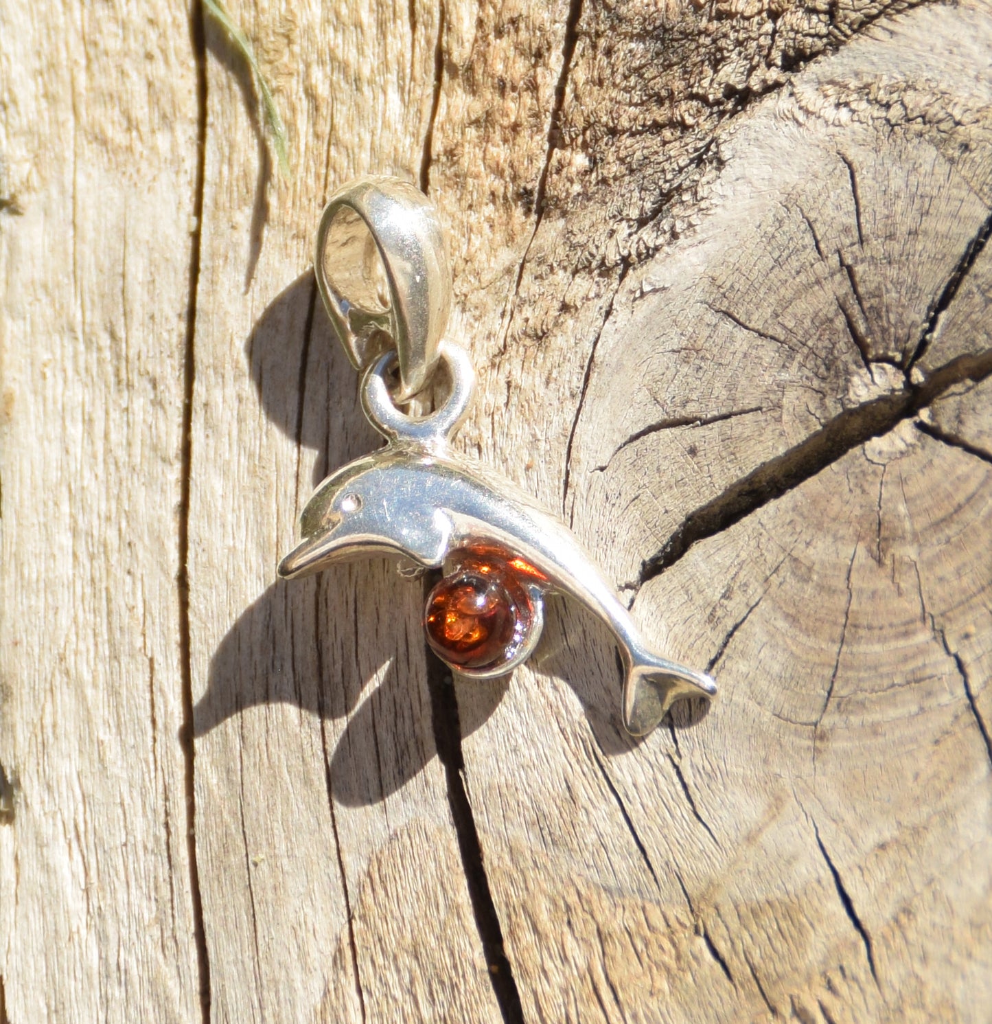 Delicate pendant with a joyful dolphin in cognac-colored natural Amber and 925 Silver, MJ Baltica, BW315