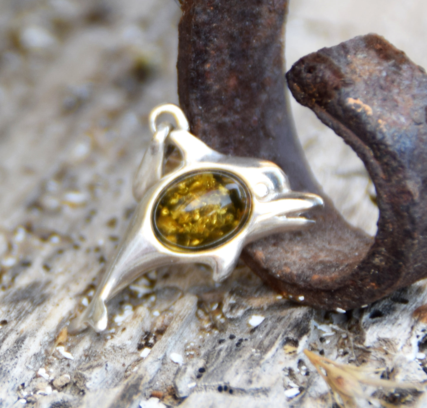 Delicate pendant with a joyful dolphin in natural green amber and 925 silver, MJ Baltica, BW320