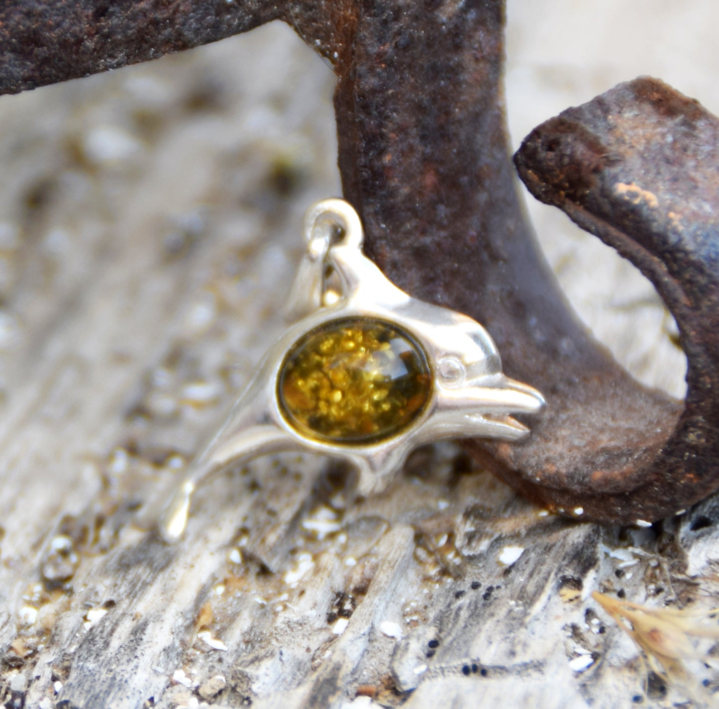 Delicate pendant with a joyful dolphin in natural green amber and 925 silver, MJ Baltica, BW320